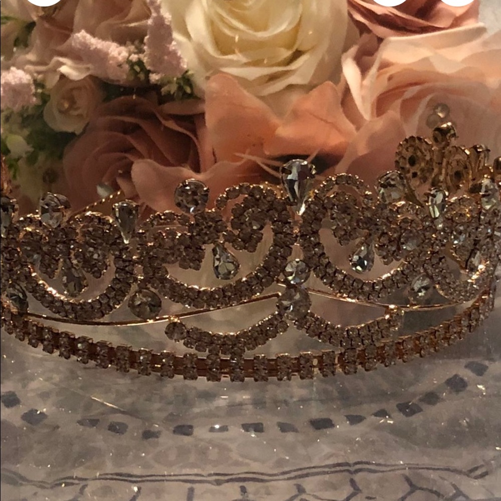 Rose gold quinceañera dress with flower bucket and crown